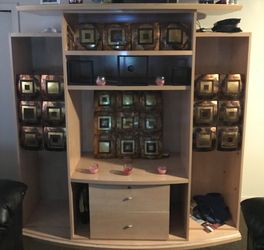 Entertainment center with art work $250