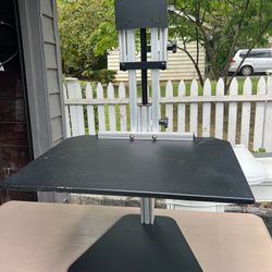 Standing desk converter Goes on top of regular desk and raises to standing desk height