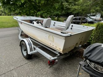 14’ Livingston boat and Trailer