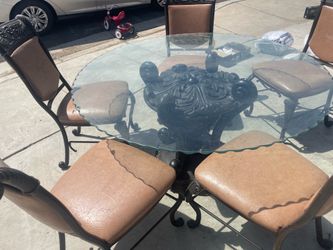 Glass table with 5 chairs