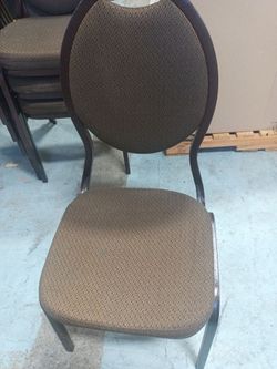 Padded, stackable, metal chairs.