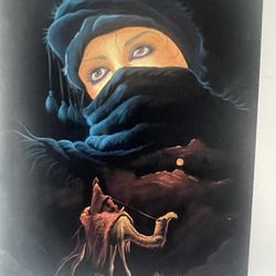ROMANTIC  MIDDLE EASTERN  BLACK VELVET PAINTING MEASUREMENTS 26” X 18” OF A BEAUTIFUL BEDOUIN WOMEN AND  MAN SITTING ON A CAMEL DREAMING OF L