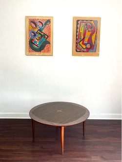 Beautiful vintage mid-century modern coffee table with a unique triangular / surfboard shape.
