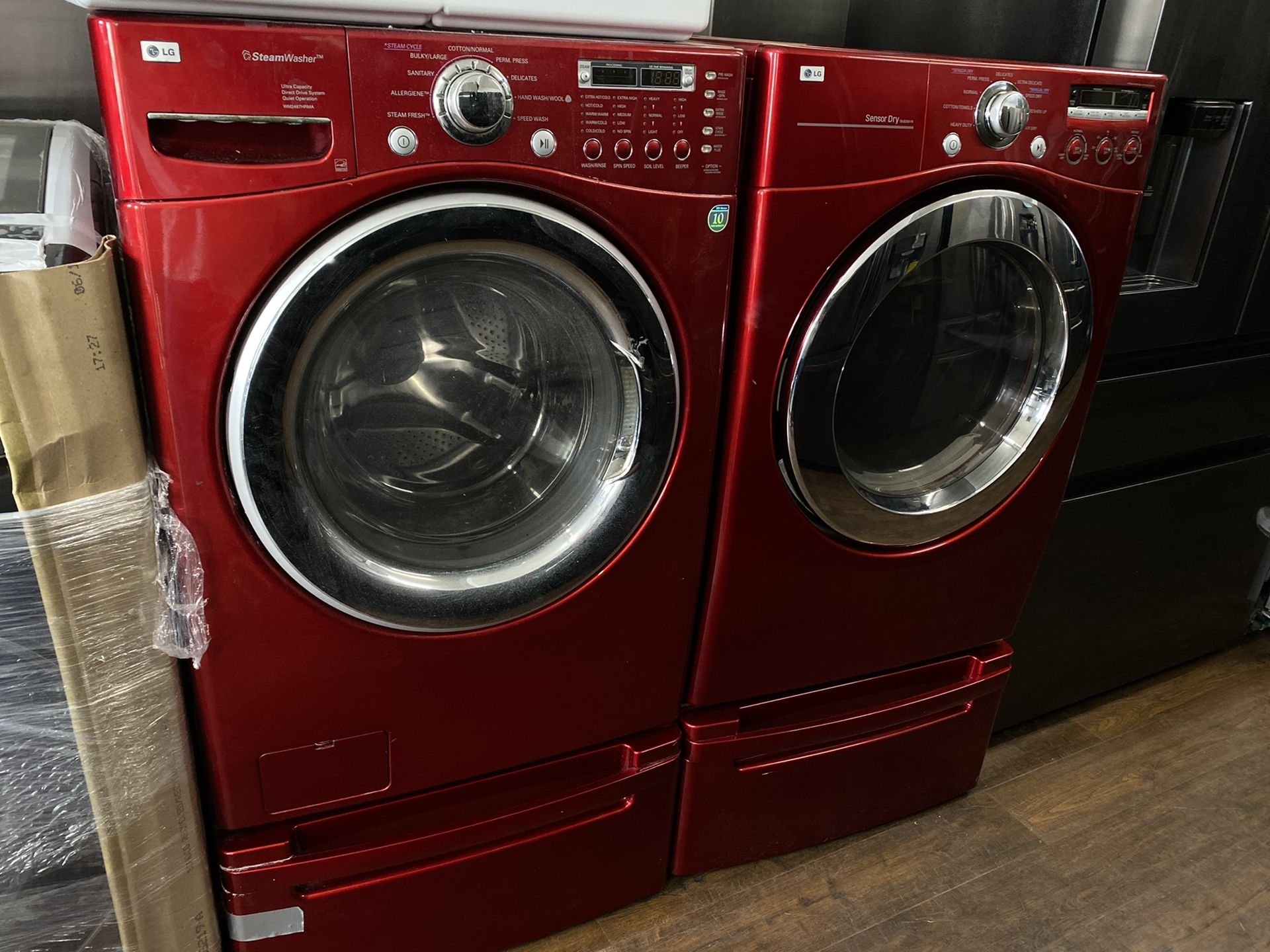 Lg he front load washer and dryer set with original pedestals