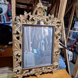 ROCOCO-STYLE CARVED GILTWOOD MIRROR