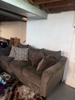 Two brown couches