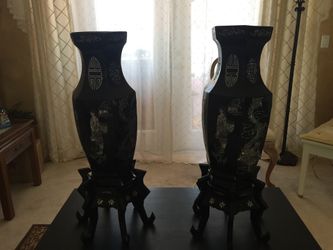 4 art floral panels, 2 oyster polish ebony varnished vases with stands