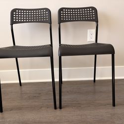 IKEA ADDE chair in black with a steel frame and polypropylene seat and back.  