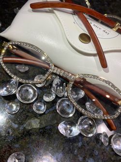 Millionaire Celebrity Glasses “Look Like Money” One (1) Unisex wooden frame with sparkling lab, diamond ice trim. Comes with a white protective case f