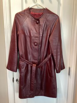 Vintage soft, burgundy, leather coat with belt, leather buttons, and pockets (no tag, but would fit size 6 or 8) 3 ft long (fabulous condition, but co