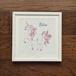 At Home Glass Framed White And Pink Unicorn “Believe” Wall Decor 