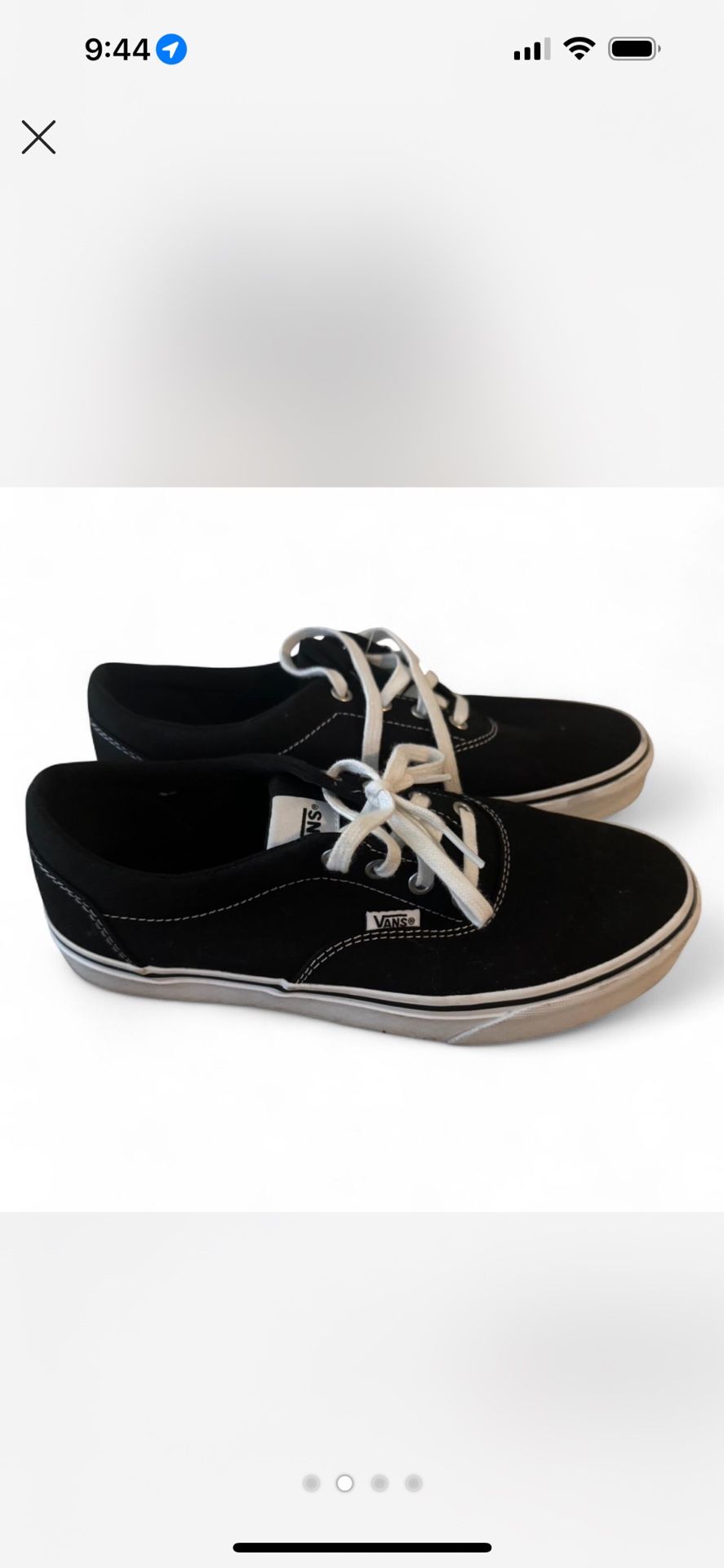 Black and white Vans low top