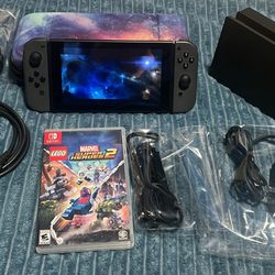 Nintendo switch with docking station, joycon grip, case and marvel super heroes 2. 