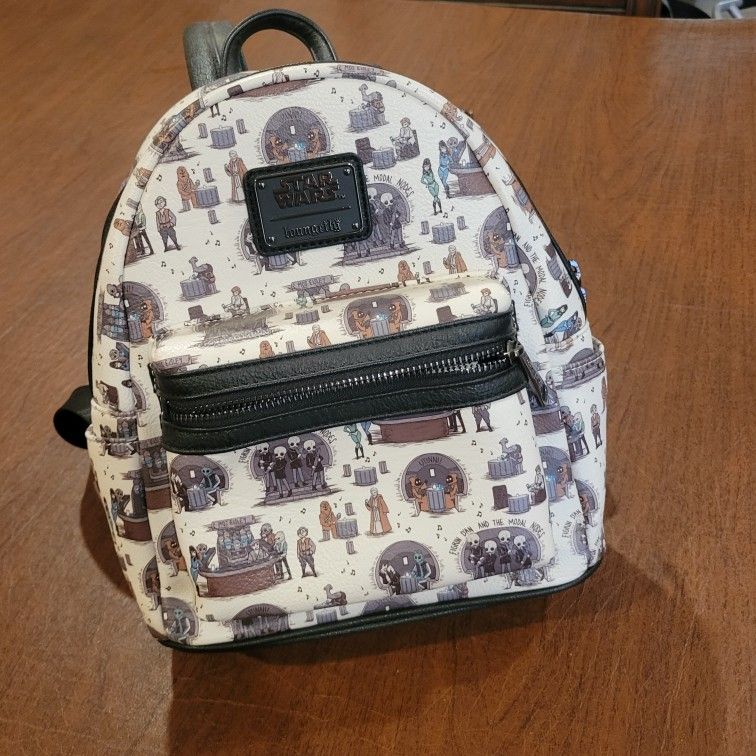 Loungefly Star Wars Mos Eisley Cantina Mini Backpack New, no tags. It
is approximately 8.5x5x10". Adjustable straps. Weight 15oz plus shipping
mate