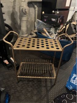 Record player stand with vinyl record storage below.