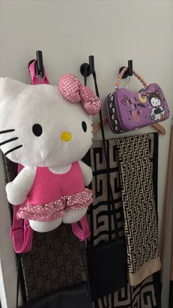 Hello kitty plush backpack and hello kitty  purse tin by Sanrio both for $10
