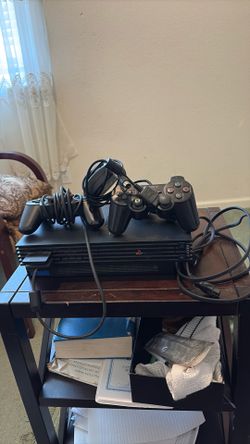 PlayStation two system two controller works perfect excellent condition