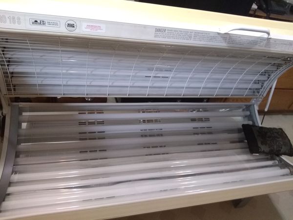 Tanning bed. New bulbs in it and a box of new ones comes