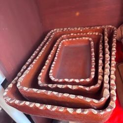 vintage Mexican Tlaquepaque pottery nesting rectangular dishes, handcrafted from red clay.