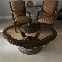 2 accent chairs and round glass top coffee table
