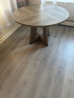 Round Wood-Tone Dining Table with Pedestal Base