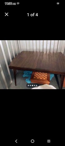 Antique dark wood dining table with leaf