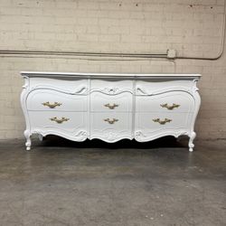 Delivery Is Available Vintage French Provincial style dresser with ornate gold hardware and carved details, painted in white$1350 Obo!