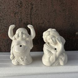 Vintage white ceramic Benihana tiki mugs, featuring a Happy Buddha and a Geisha girl design.
