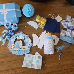 Baby shower decorations for a boyVarious decorative items, badges, and souvenirs for a baby shower