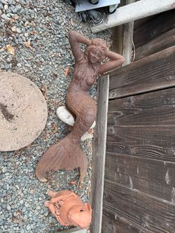 Big heavy mermaid that sits on your pond