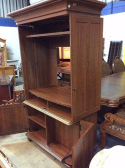 Wooden armoire with fold back doors
