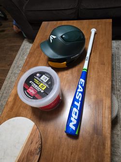 Baseball bat, batting helmet, and baseballs.