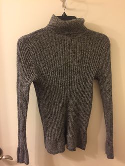 Woman gray turtle neck shirt