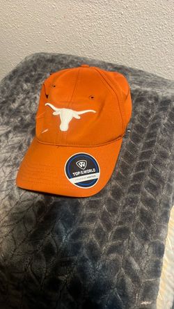 The item pictured is a Top of the World Texas Longhorns Staple Adjustable Hat in Texas Orange.