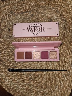 The Amor Palette Luna Magic Eyeshadow Palette with makeup brush