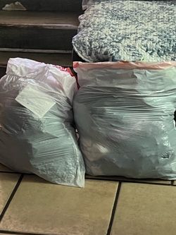 Two bags of girls clothes, 1012 and 14