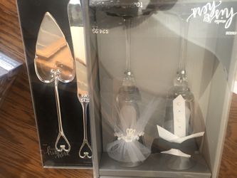 Cake knife and bride and groom glass