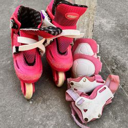 Pink Roller Skates With Knee And Elbow Pads