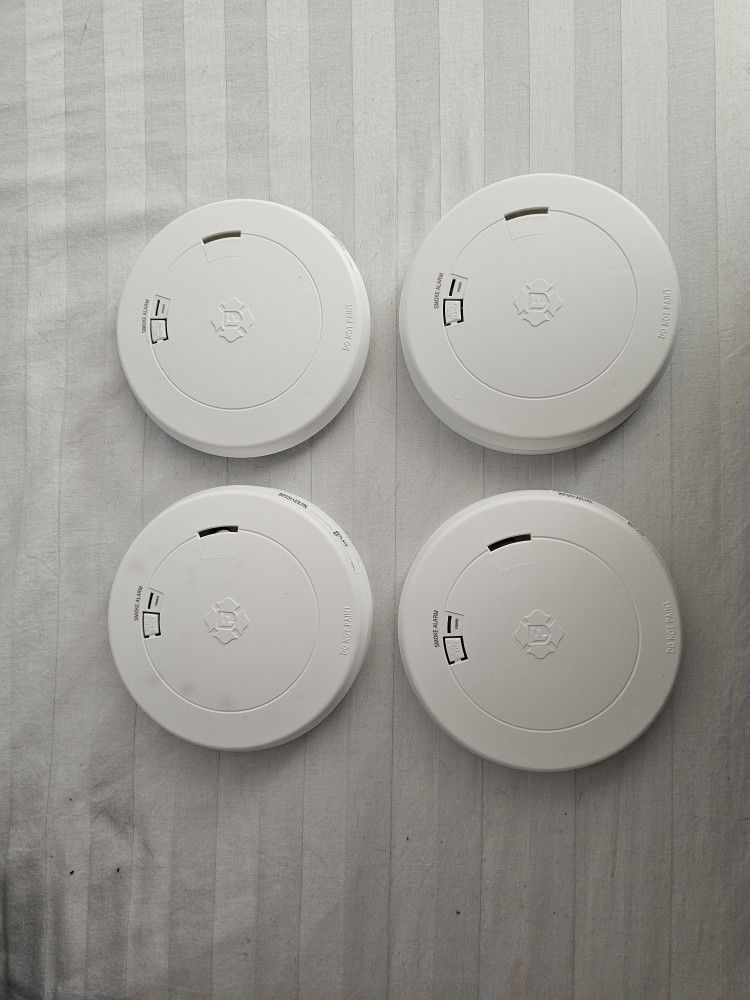 4 First Alert Smoke Detectors.