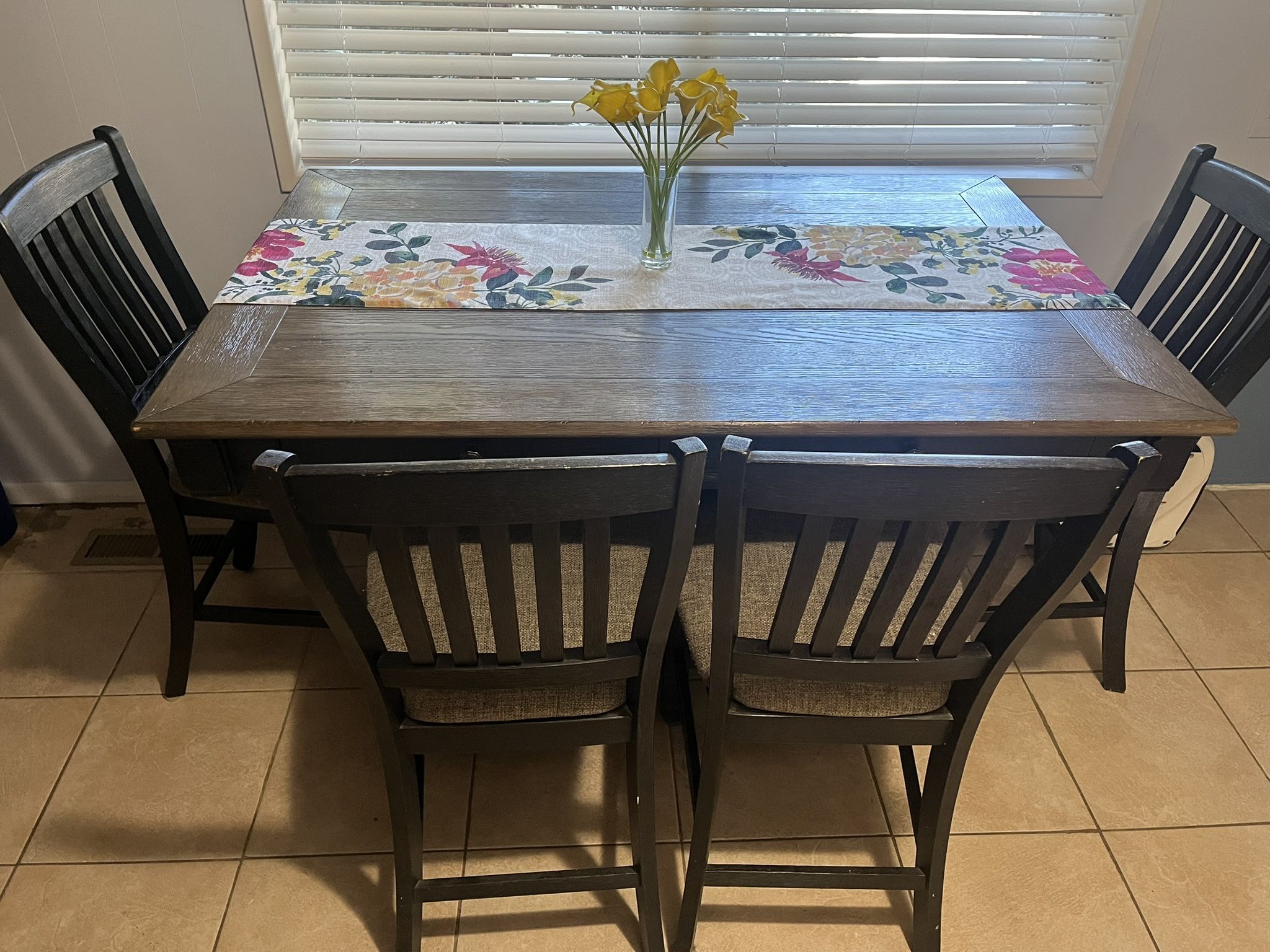 Ashley Furniture dining table with wine rack.