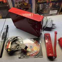 Red Nintendo Wii with new mario bros Wii 