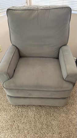 Light Gray Upholstered rocking recliner.