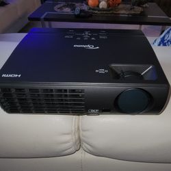 For sale a this Set " Optoma " new" projector DAEPTGUUp  with matching DA-lite  108" inches Wide movie Screen model B with CSR.