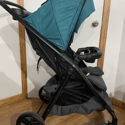 Dark Gray and Turquoise Evenflo Stroller 