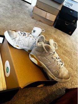 White and yellow Jordans