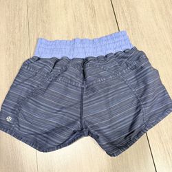 Lululemon blue striped athletic shorts with zippered pocket