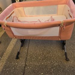 ANGELBLISS or ihoming 3-in-1 bedside bassinet sleeper in pink. 