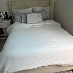 Upholstered cream full size bed and mattress