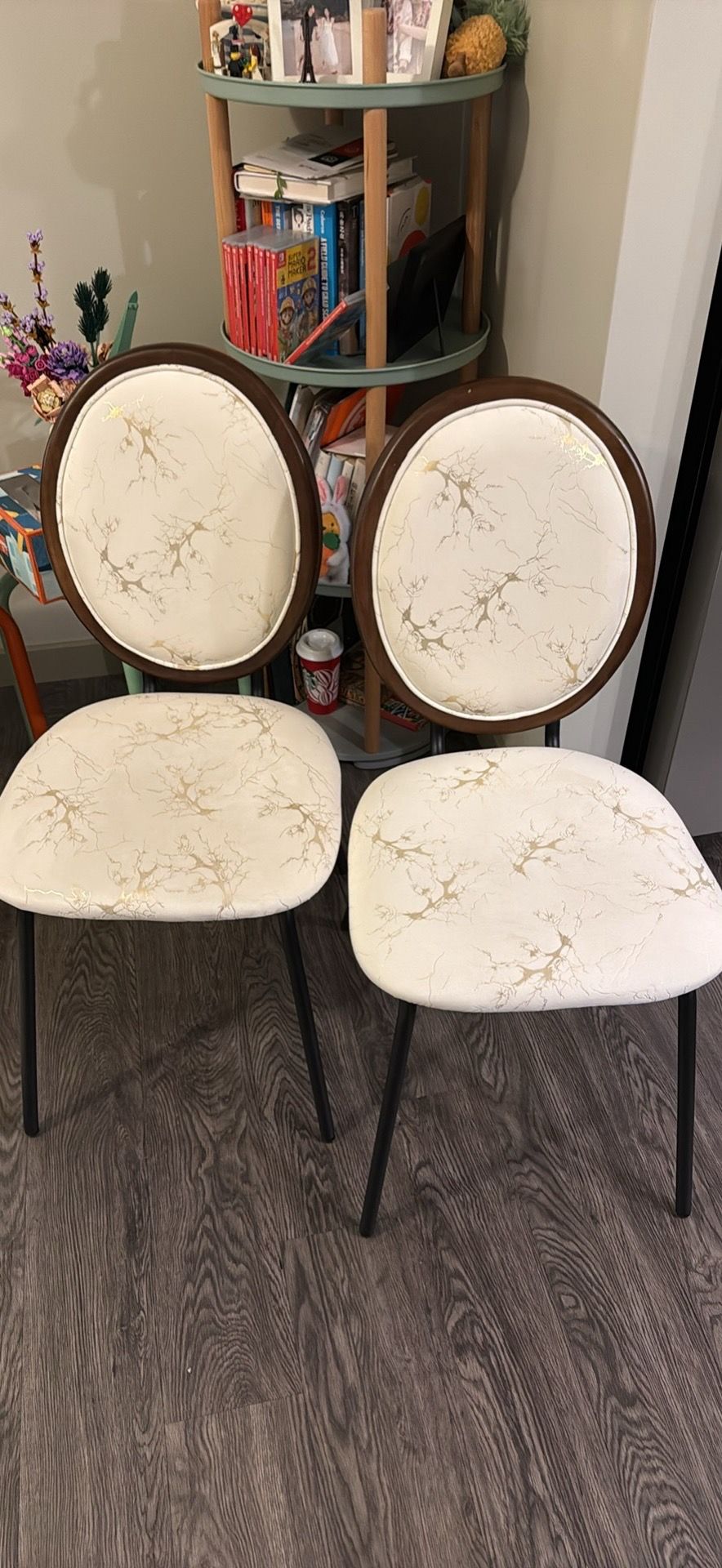 A set of two dining chairs