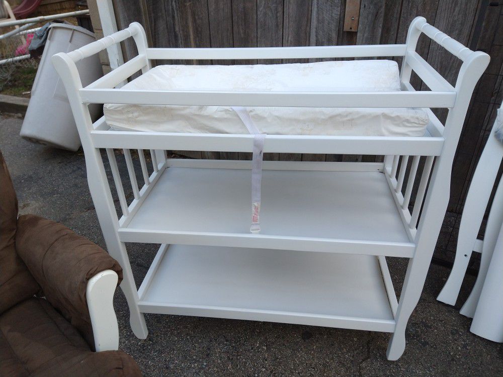 Changing table and crib